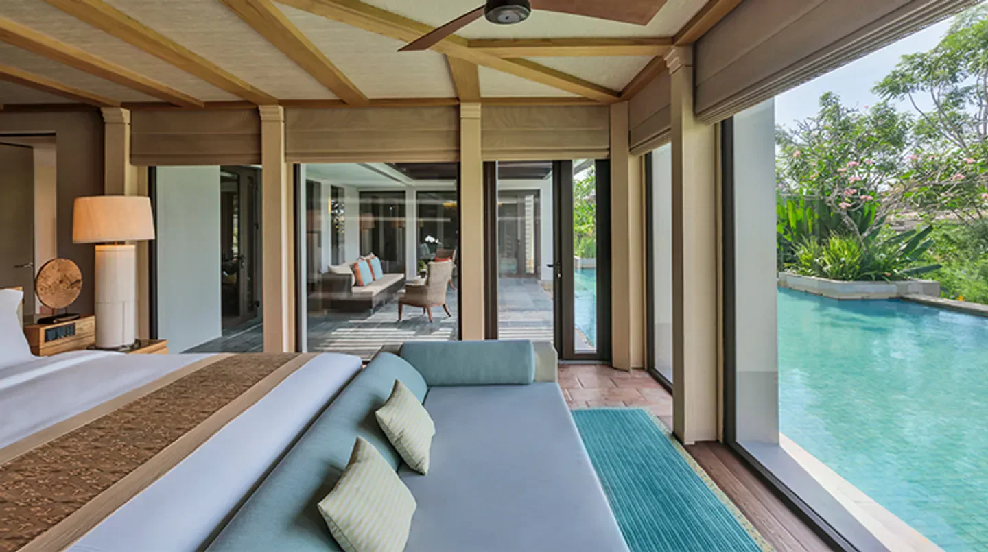 Luxury bedroom at The Ritz-Carlton, Bali, with pool view in Bali.