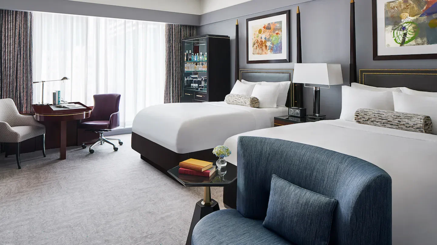 Luxury guest room at The Ritz-Carlton, Charlotte, featuring comfortable beds and stylish decor
