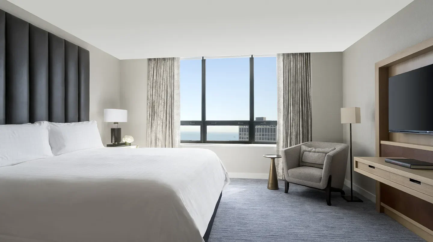 Cozy bedroom at The Ritz-Carlton, Chicago, featuring city views of Chicago.