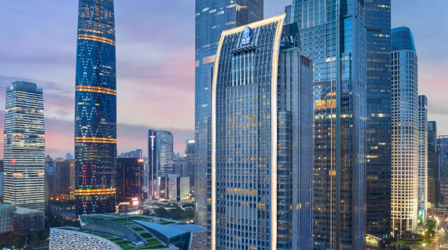 The Ritz-Carlton, Guangzhou hotel exterior at dusk in Guangzhou, China