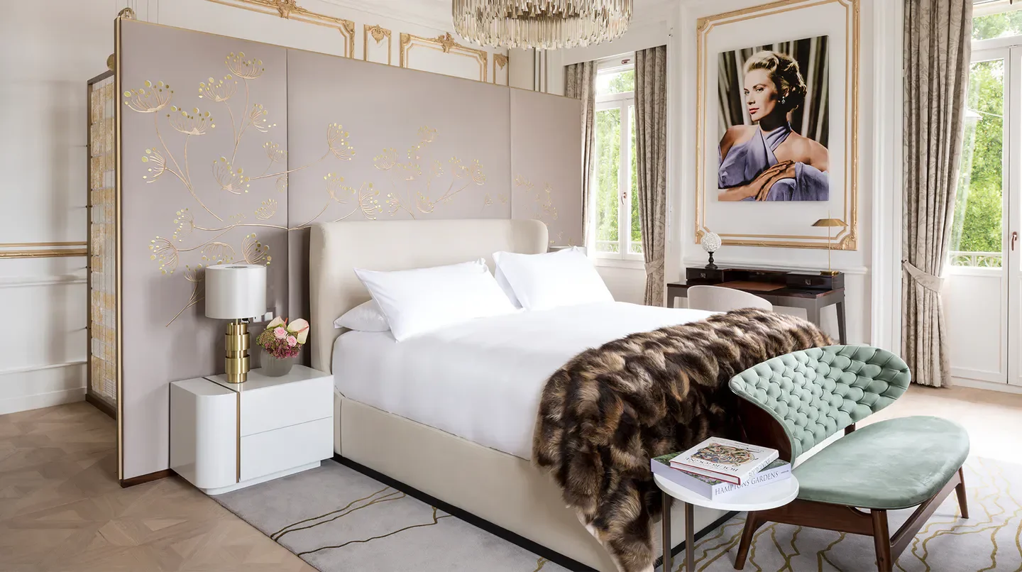 Luxury bedroom at The Ritz-Carlton Hotel de la Paix, Geneva, featuring elegant decor.