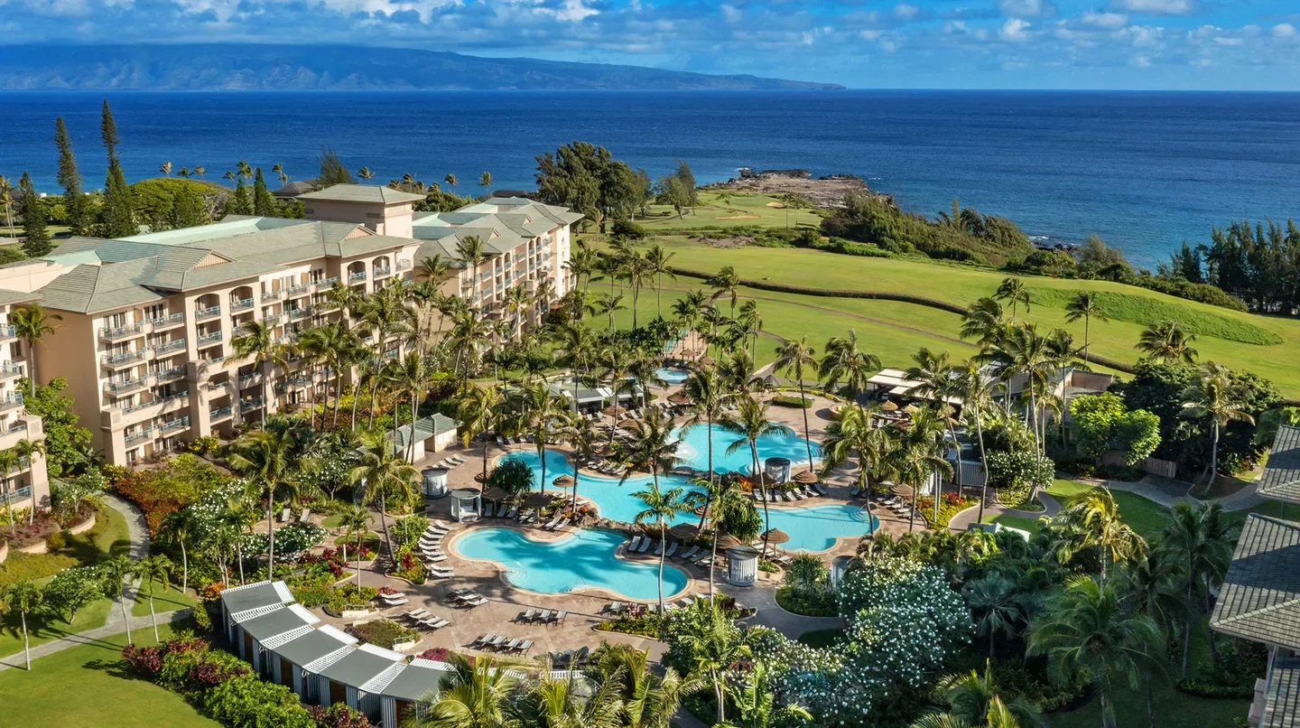 Aerial view of The Ritz-Carlton Maui, Kapalua with ocean and pools on Maui.