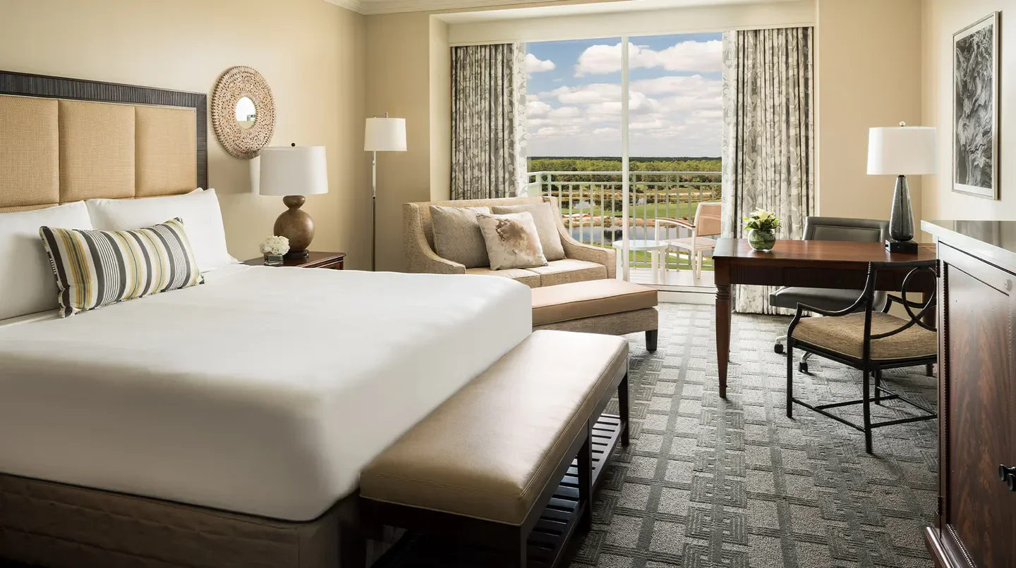 Elegant hotel room at The Ritz-Carlton Naples, Tiburón in Naples Florida with golf course views.