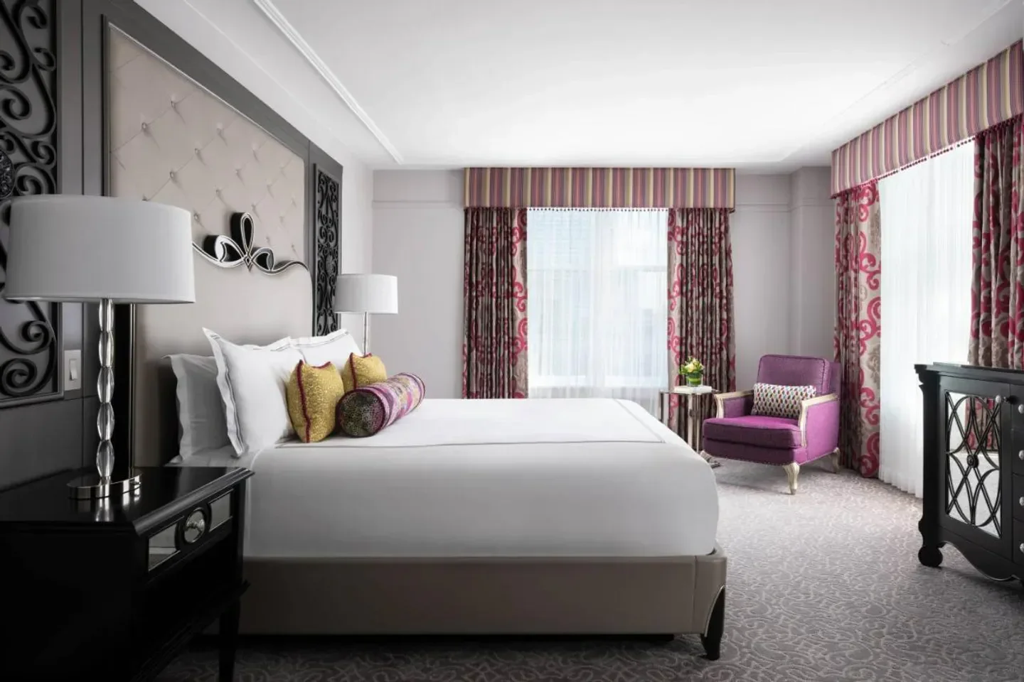 Elegant bedroom at The Ritz-Carlton, New Orleans. Luxury hotel room in New Orleans.