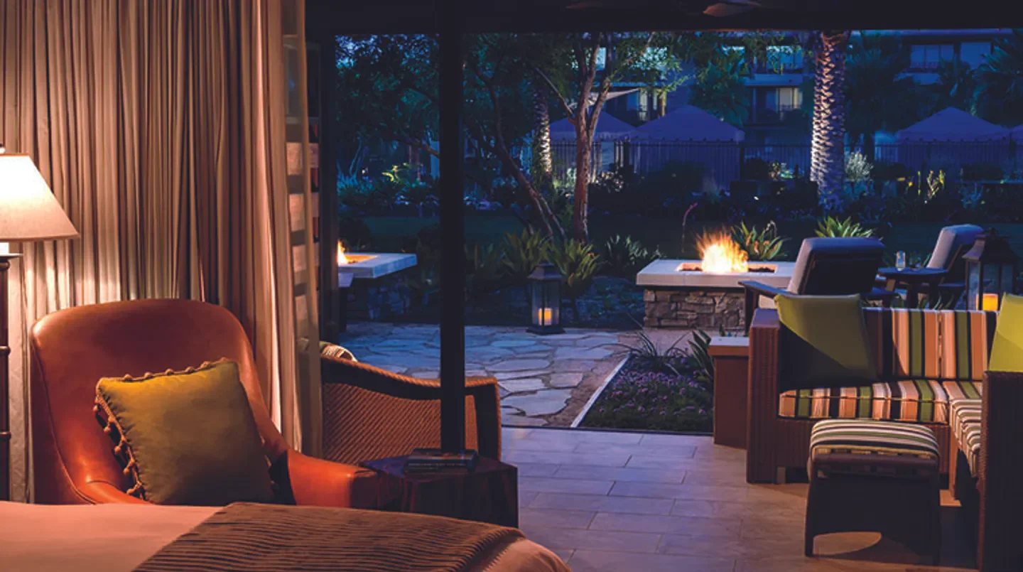 Cozy patio at The Ritz-Carlton, Rancho Mirage in Palm Springs, featuring fire pit and seating.