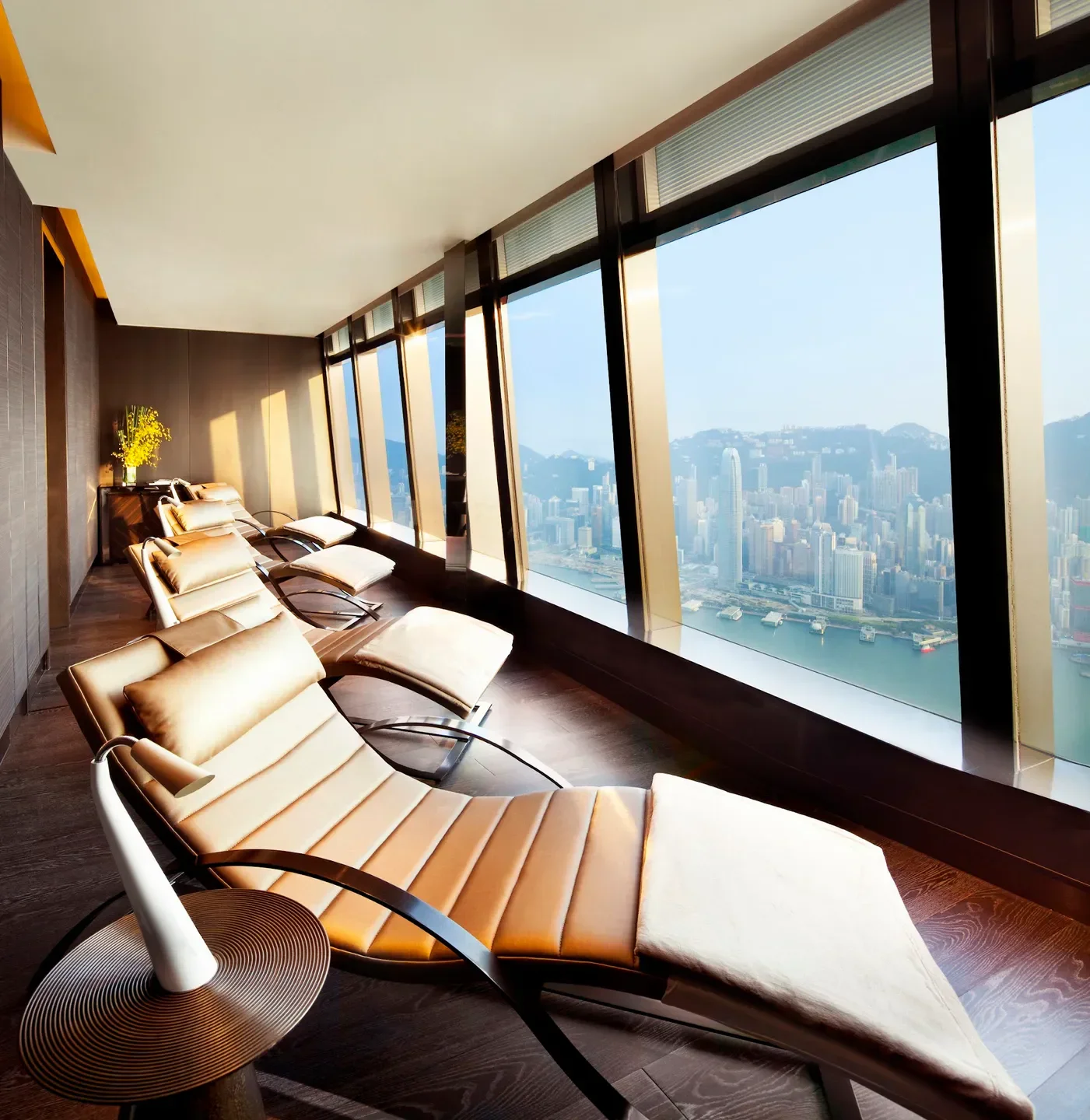 Relaxation area with city views at The Ritz-Carlton Spa, Hong Kong, overlooking Hong Kong.