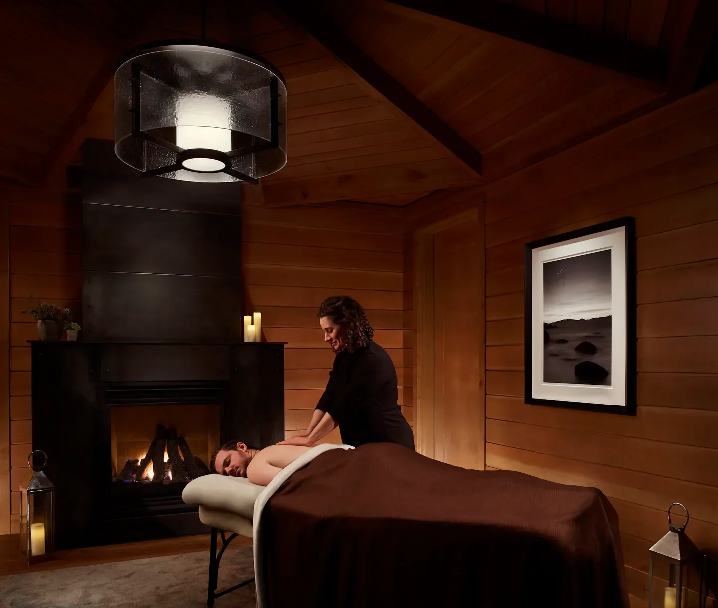 Massage at The Ritz-Carlton Spa, Lake Tahoe, in a cozy room with fireplace in Tahoe.
