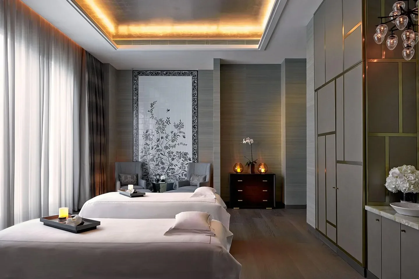 Serene spa treatment room at The Ritz-Carlton Spa, Macau with elegant floral decor