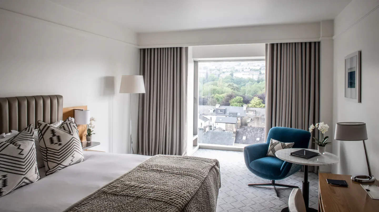 Cozy hotel room at The River Lee in Dublin with a view of the city