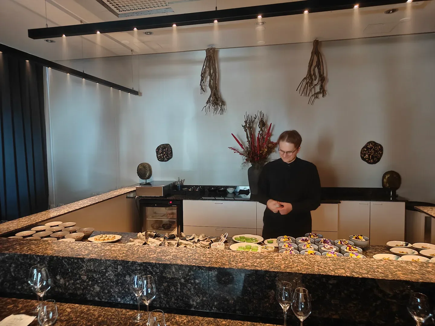 Chef preparing dishes at The ROOM by Kozeen Shiwan restaurant in Helsinki, Finland.