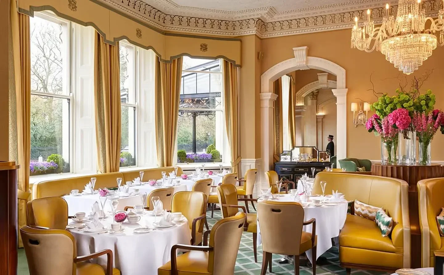 Elegant dining room at The Saddle Room in Dublin with bright floral arrangements
