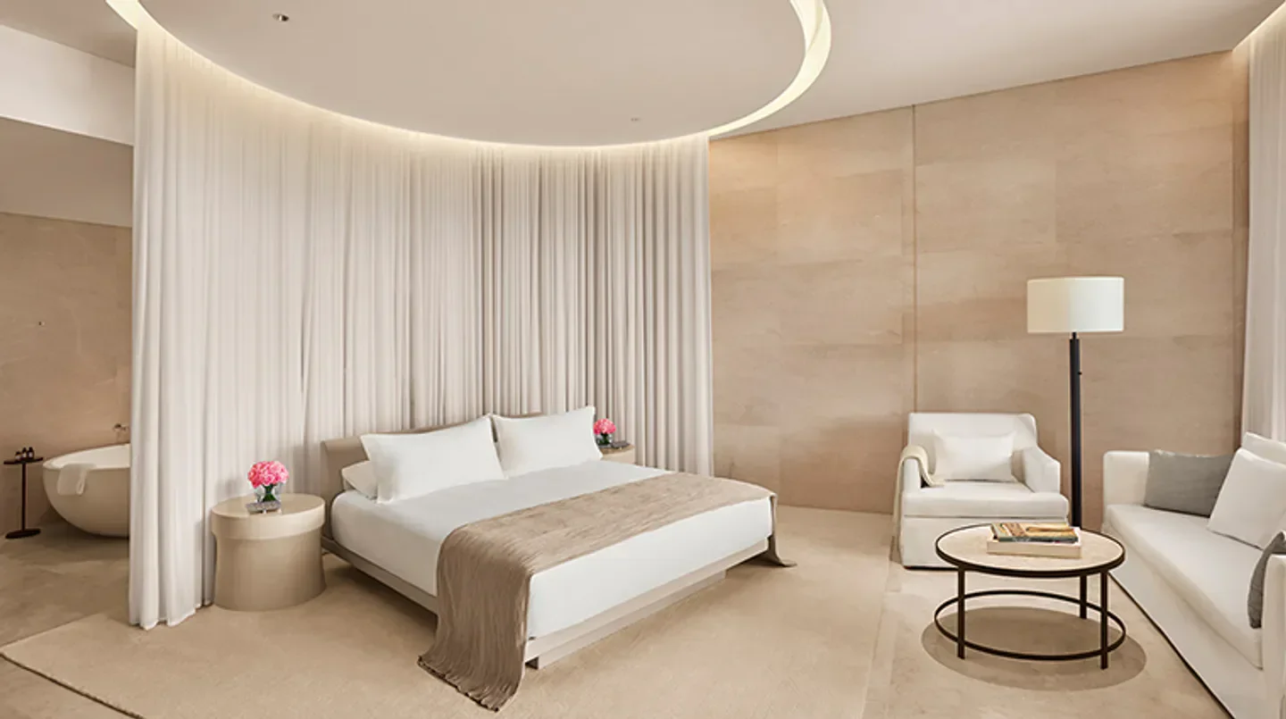 Elegant bedroom at The Sanya EDITION hotel in Sanya, featuring a luxurious design