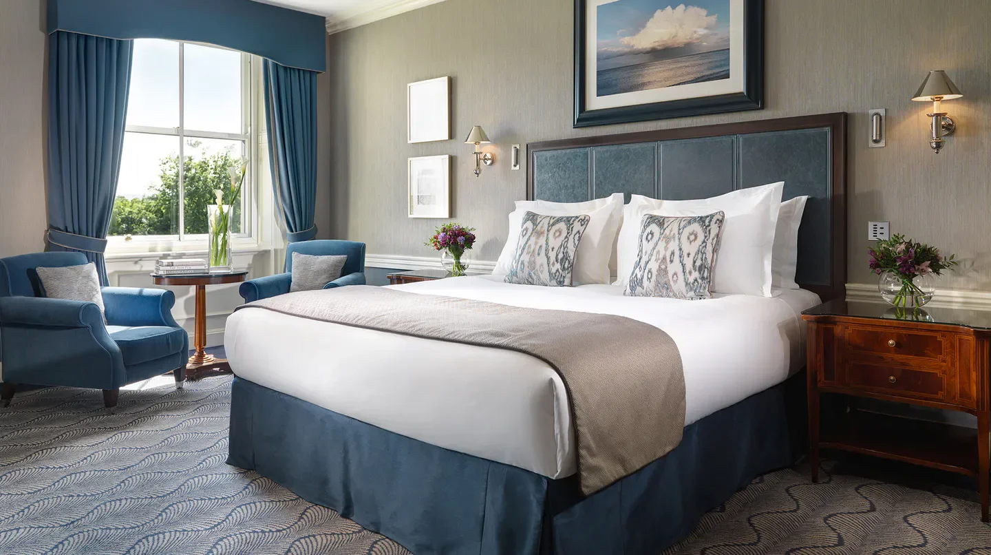 Cozy bedroom at The Shelbourne Dublin, Autograph Collection, Dublin, featuring elegant decor.