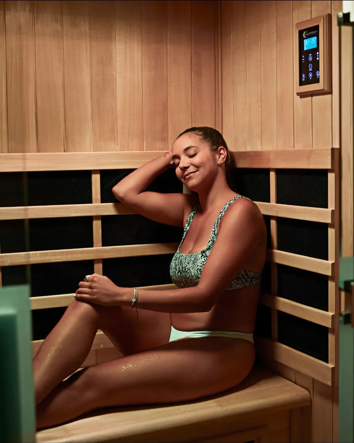 Woman relaxing in sauna at The Spa at Carillon Miami Beach, Miami.