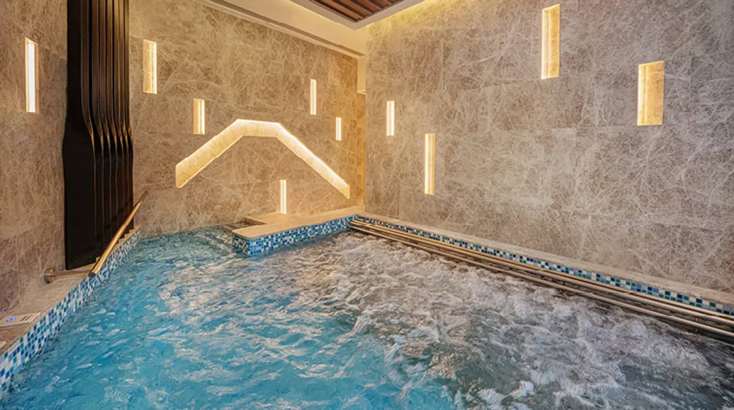 Relaxing spa pool at The Spa at Epic Tower in Macau, luxurious wellness experience.