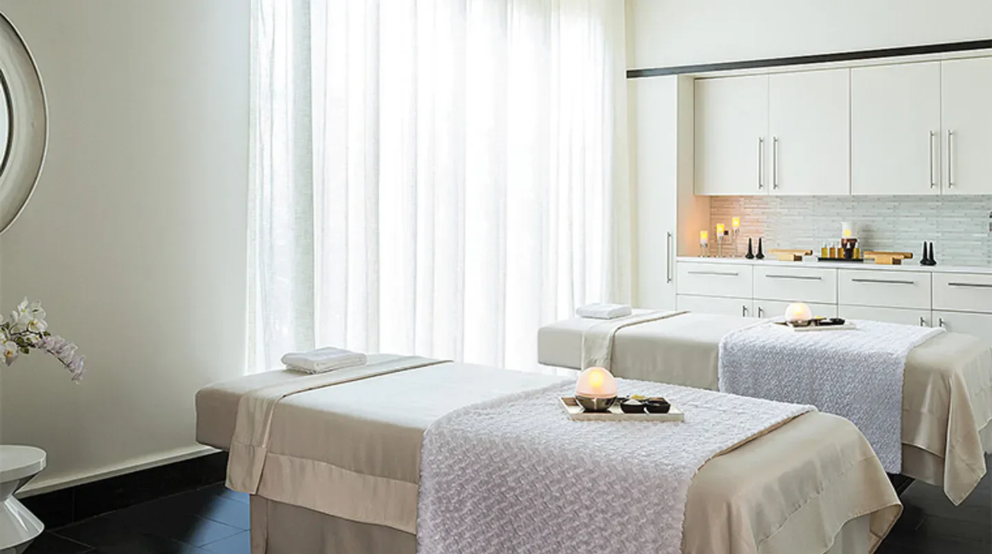 Spa treatment room at The Spa at Four Seasons Resort Orlando; tranquil Orlando setting.