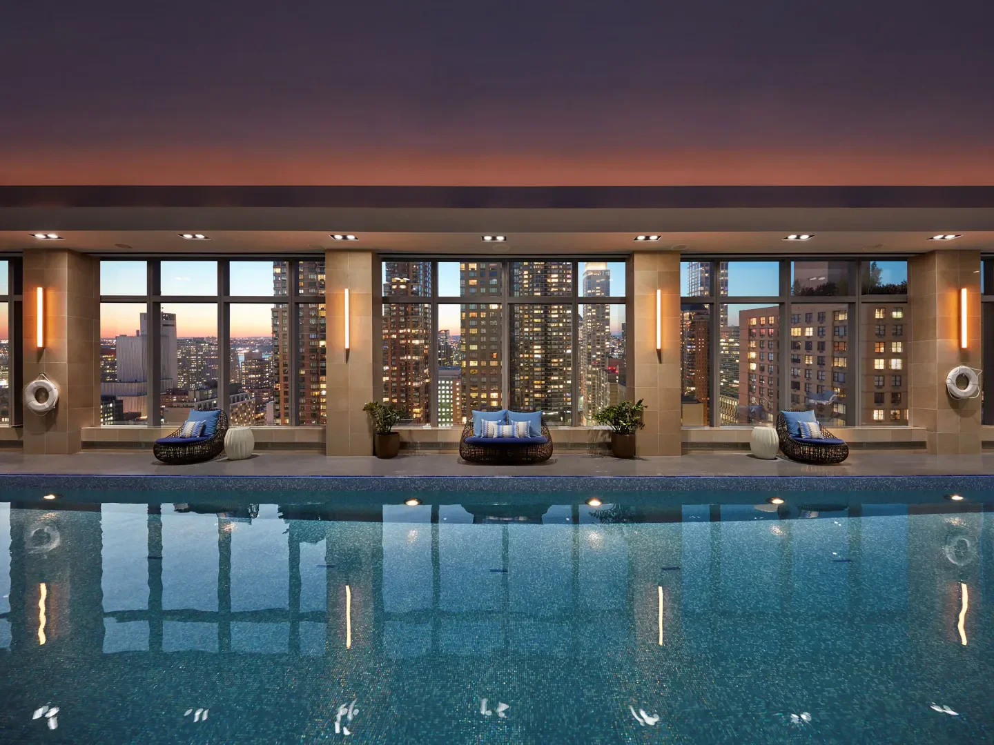 Indoor pool at The Spa at Mandarin Oriental, New York, with views of New York City skyline