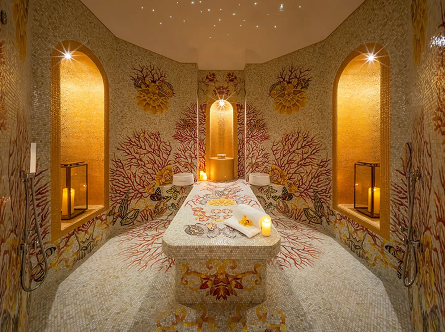 Luxurious spa treatment room at The Spa at Palazzo Versace Macau with mosaic walls.