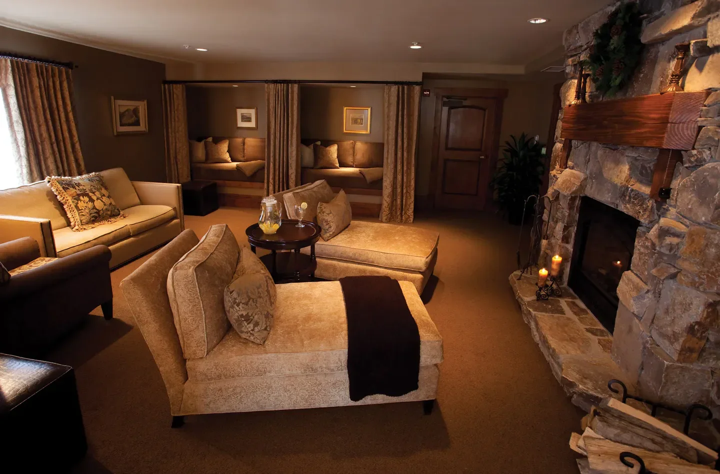 Relaxing lounge area at The Spa at Stein Eriksen Lodge in Park City, with fireplace.