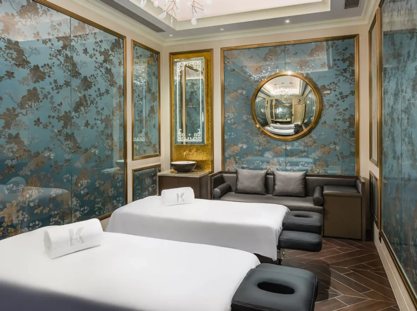 Elegant spa room at The Spa at THE KARL LAGERFELD in Macau, with floral decor