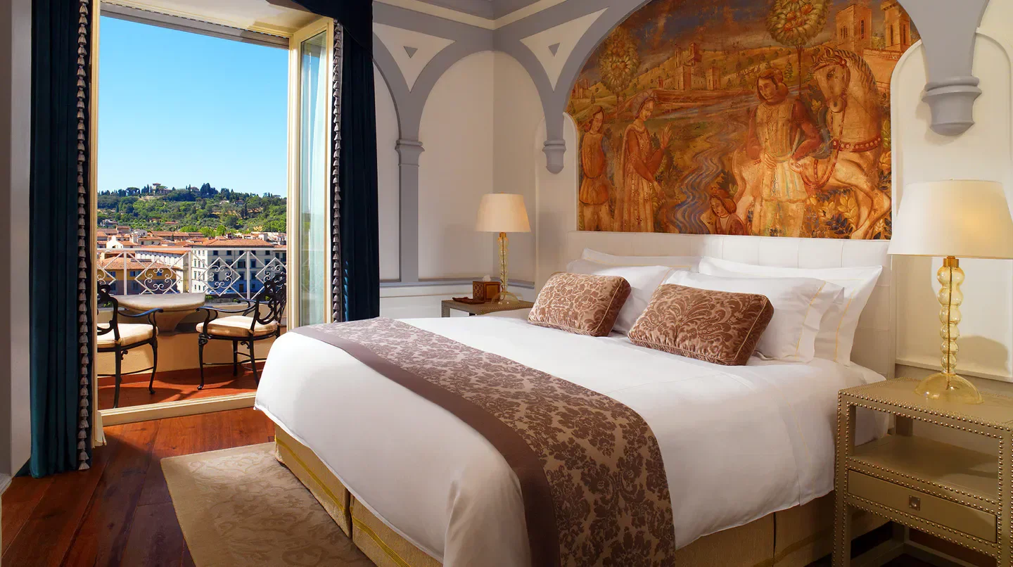 Elegant room at The St. Regis Florence with balcony overlooking the city of Florence.
