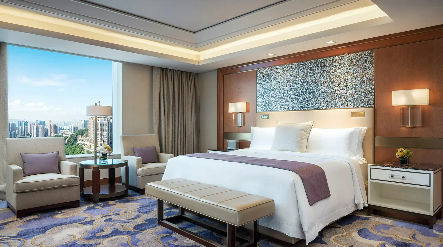 Luxury bedroom at The St. Regis Macao with city views of Macau, stylish interior