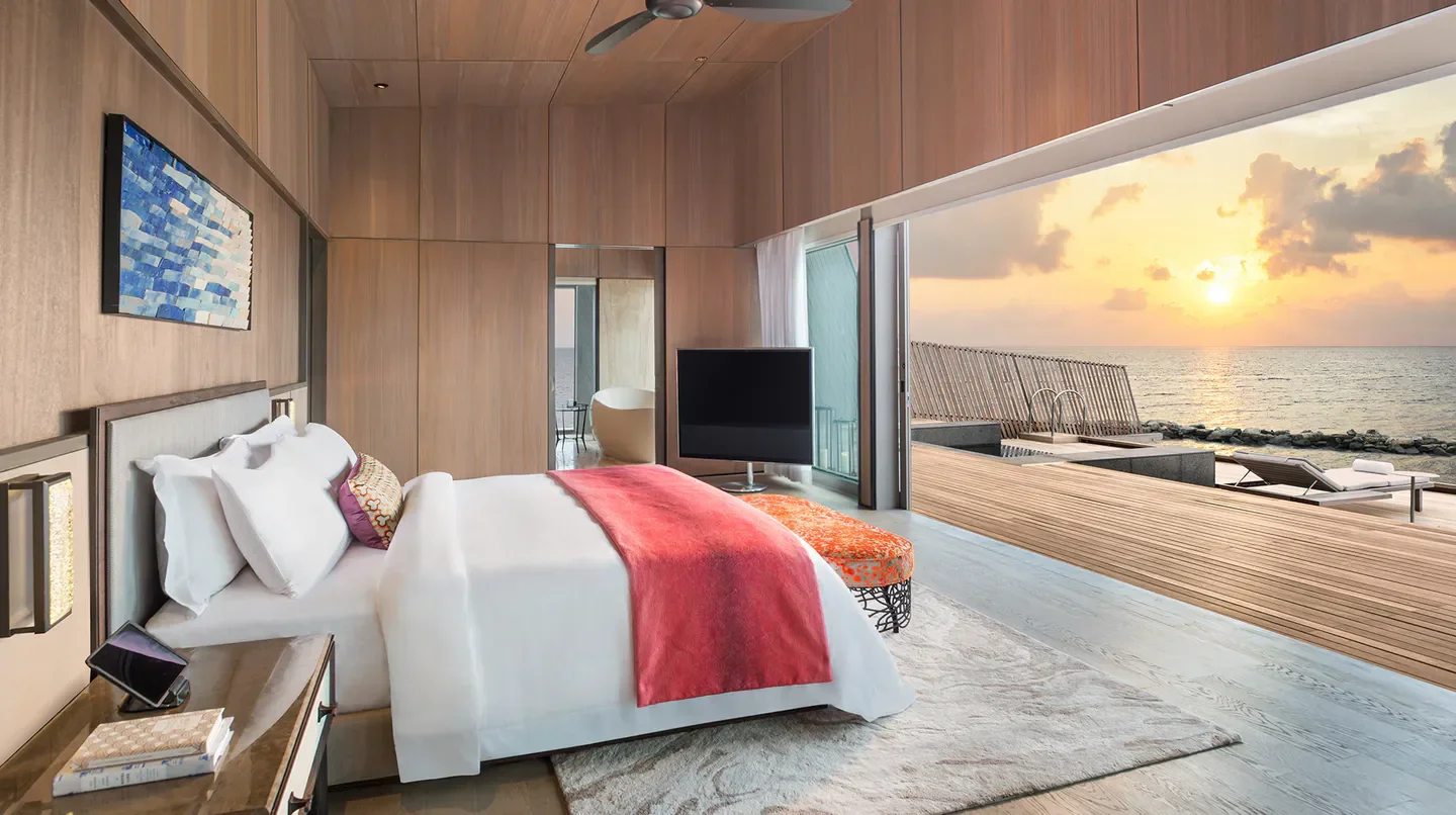 Bedroom view at The St. Regis Maldives Vommuli Resort, Maldives, with ocean sunset
