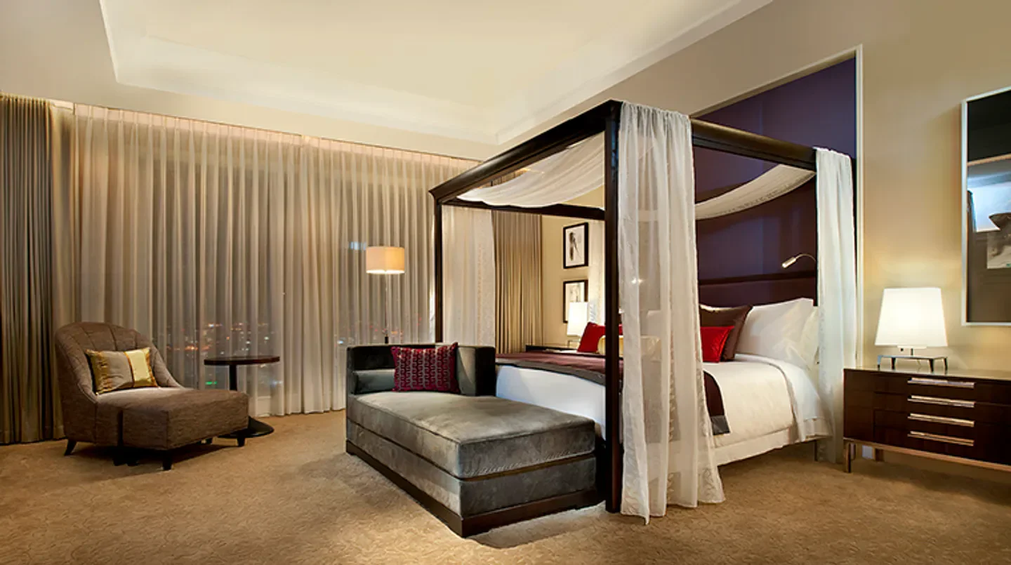Luxury bedroom at The St. Regis Osaka. Elegant canopy bed with city view in Osaka.
