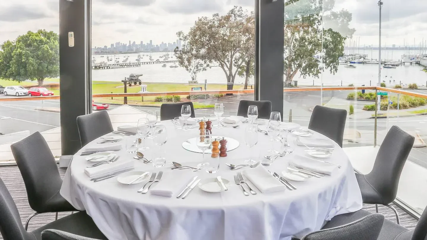 Table setting at The Strand restaurant in Melbourne with bay views and city skyline