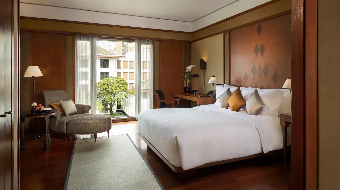 Elegant bedroom at The Sukhothai Bangkok, offering luxurious comfort in Bangkok.