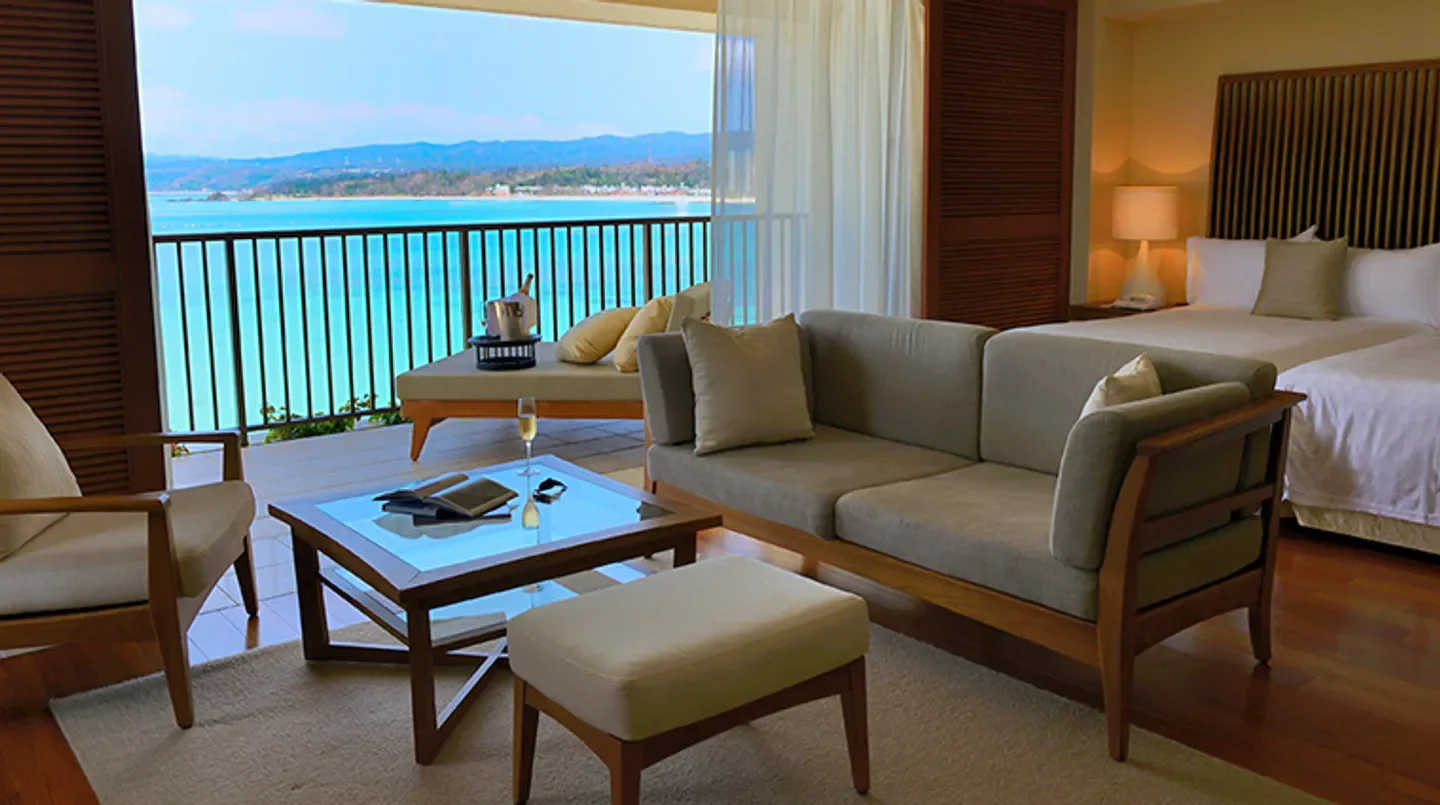 Luxury room at The Terrace Club at Busena, Okinawa, featuring ocean view and stylish decor.