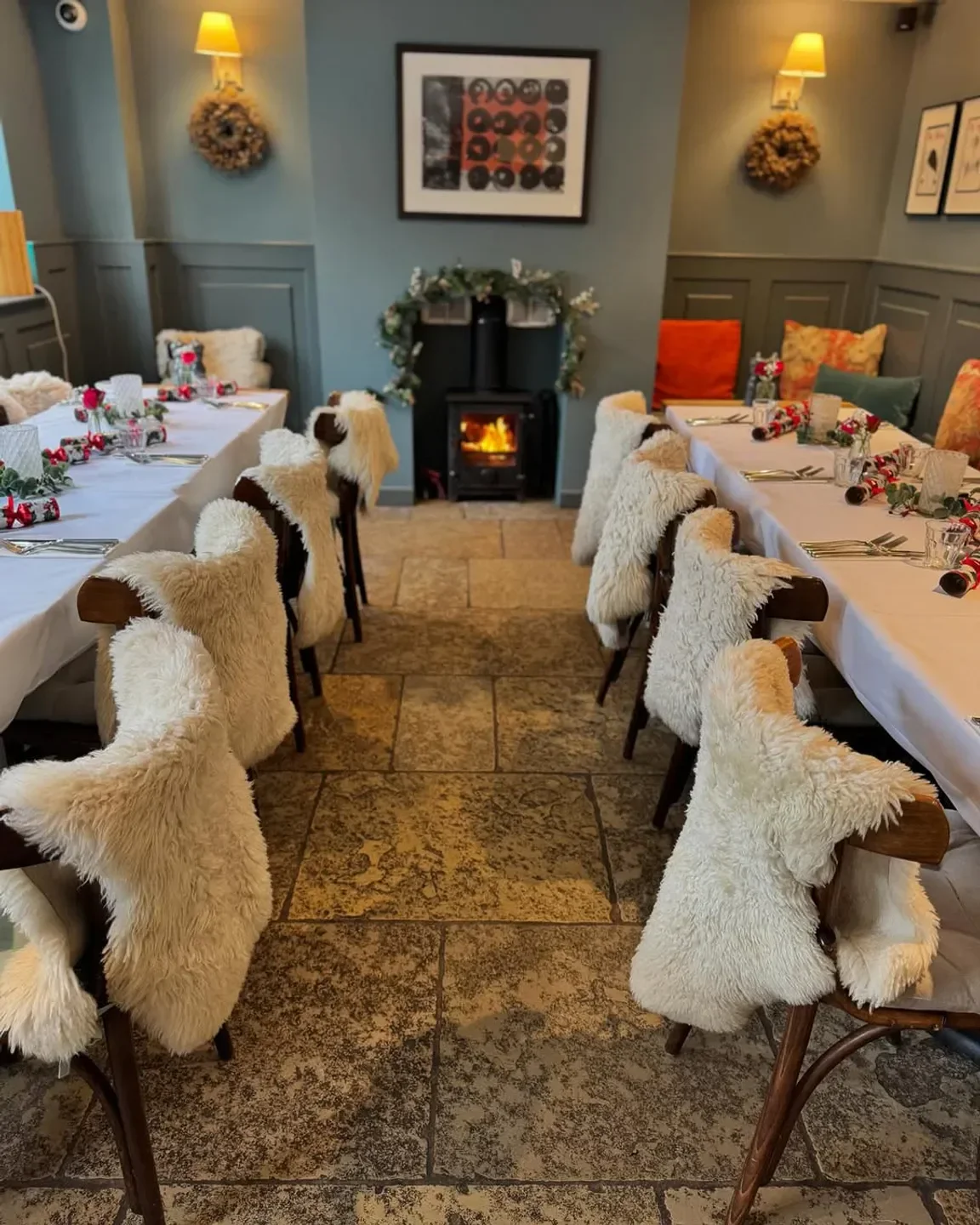 Cozy dining room at The Three Hills restaurant in Cambridge, featuring a fireplace.