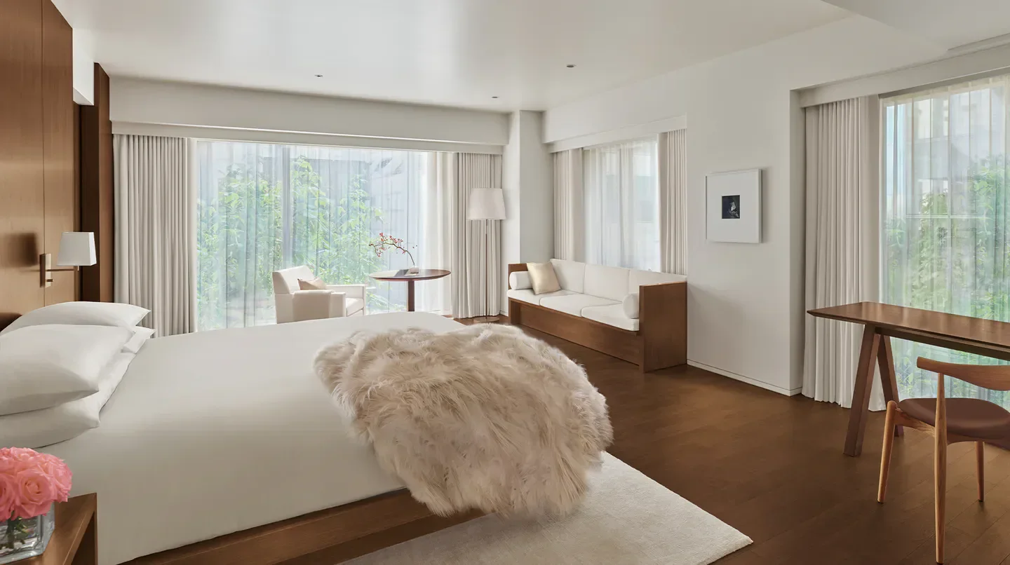 Bright, modern bedroom in The Tokyo EDITION, Ginza, with a view of Tokyo