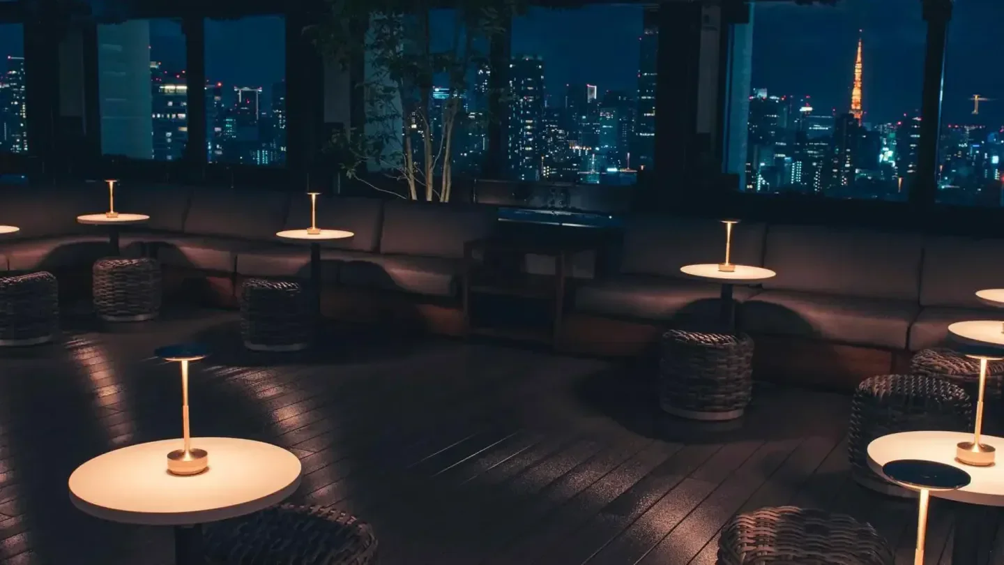 Night view from The Top at The Aoyama Grand Hotel in Tokyo with seating.