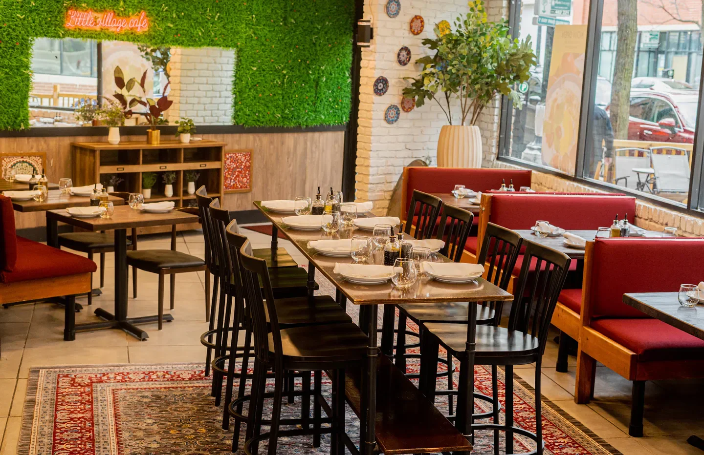 Interior of The Village restaurant in Chicago, with tables set and ready for diners.