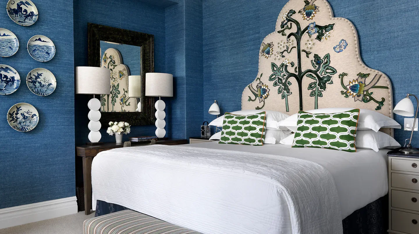 Cozy bedroom at The Whitby Hotel in New York City, featuring stylish decor.