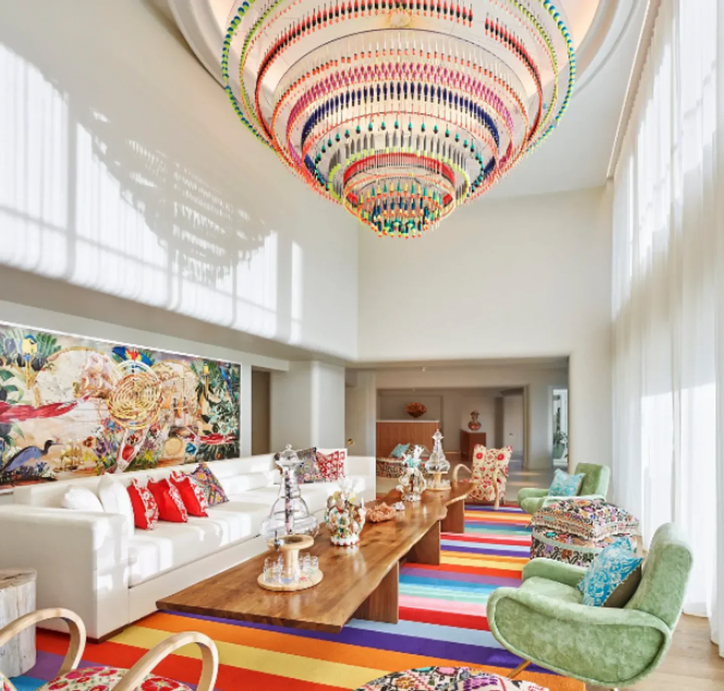 Interior of Tierra Santa Healing House in Miami Beach with colorful decor and chandelier.