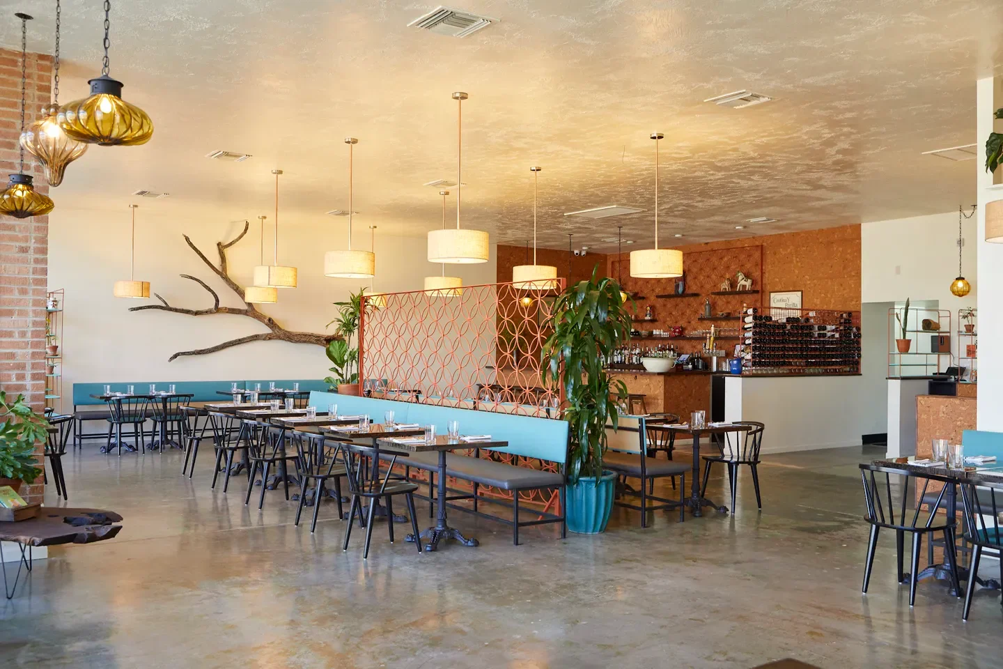 Interior of Tito and Pep in Tucson: tables, modern decor, and inviting atmosphere.