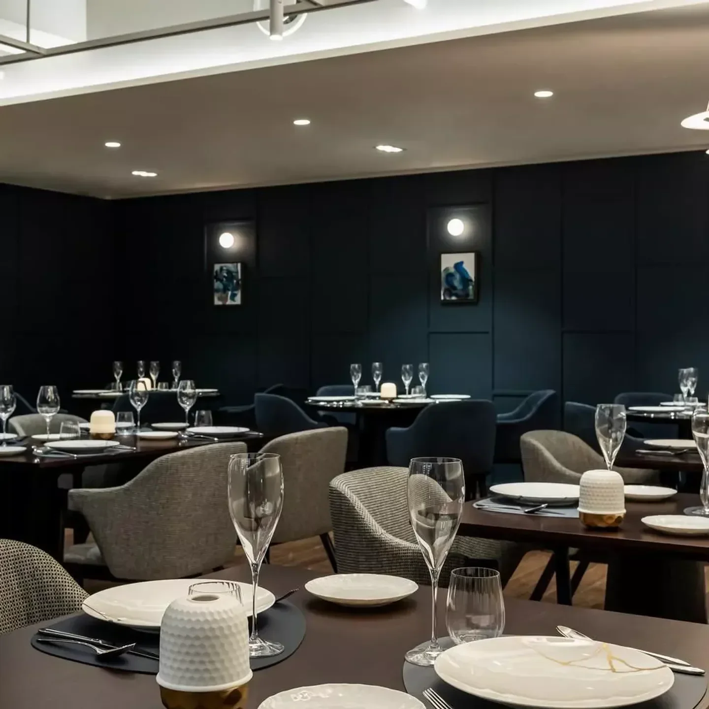 Elegant dining room interior at Toc Toc restaurant in Seoul, with tables set for service.