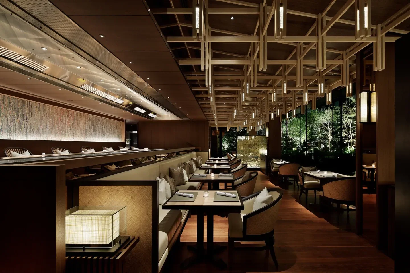 Elegant dining area at TOKi restaurant in Tokyo with wooden beams and ambient lighting