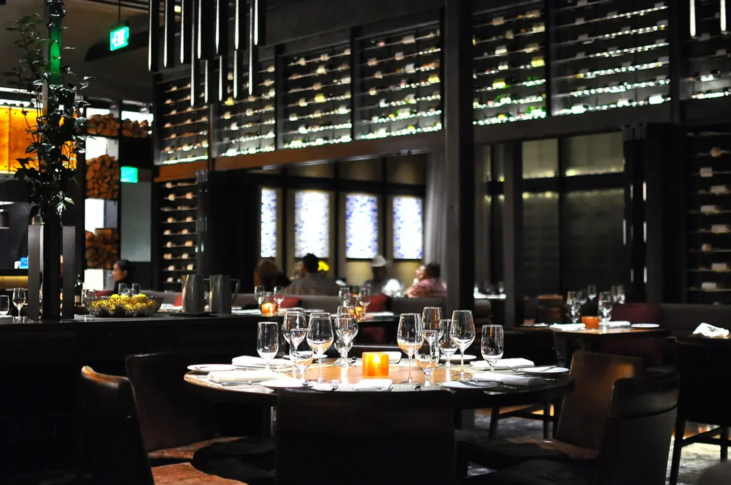 Elegant dining at Tom Colicchio's Heritage Steak in Las Vegas with wine display.