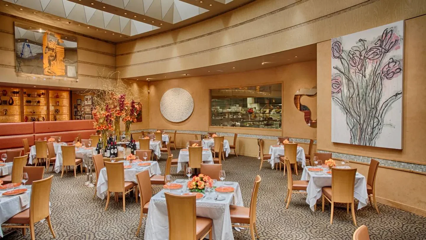 Elegant dining room at Tony's in Houston, with tables set for a fine dining experience.
