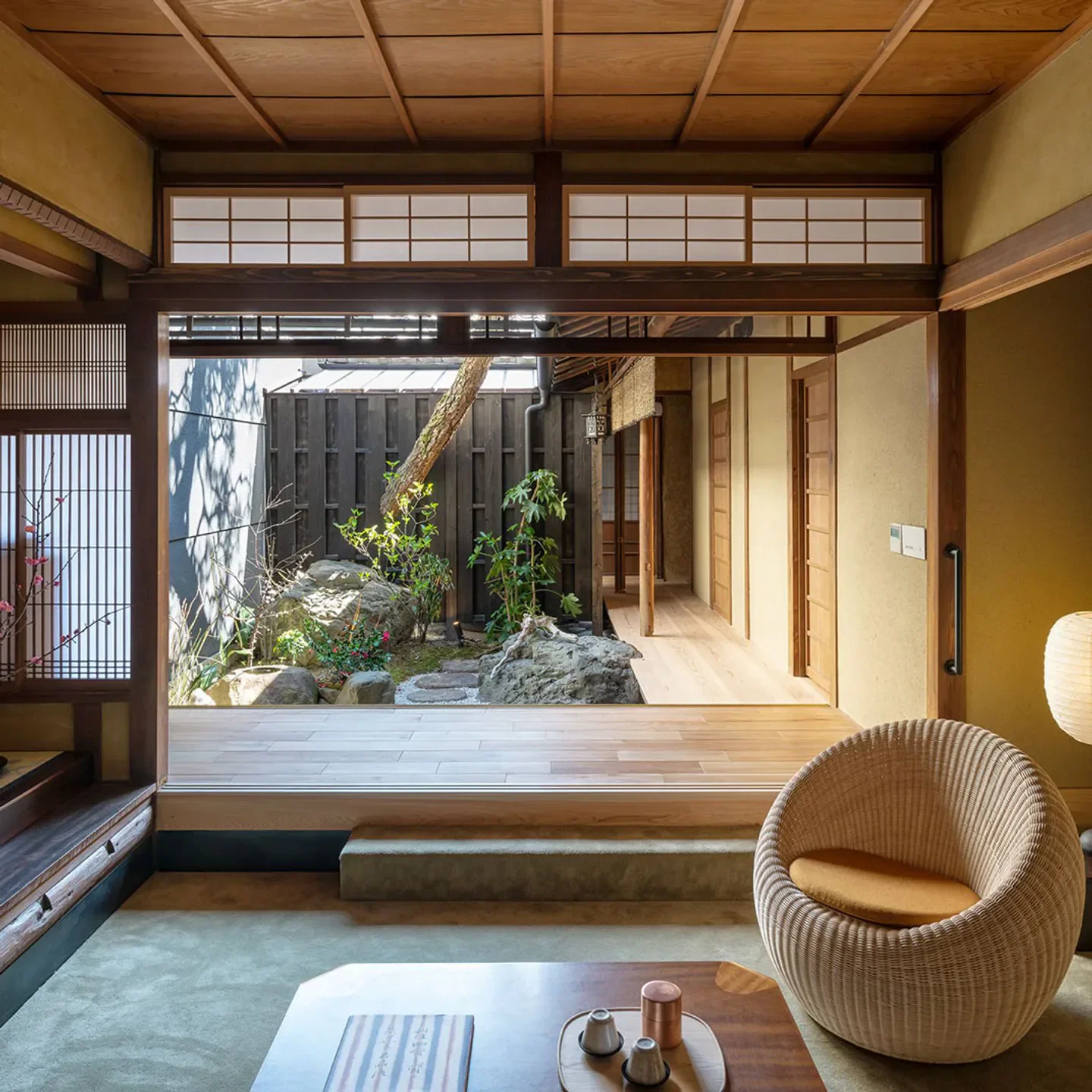 Interior of Tozentei restaurant in Kyoto, featuring a traditional Japanese design and garden view.