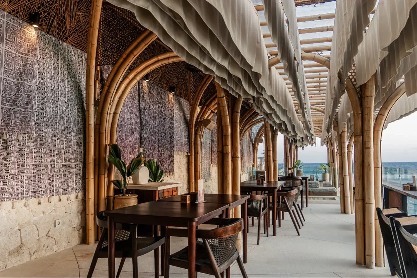 Tropical Temptation Beach Club in Bali with bamboo arches and ocean views