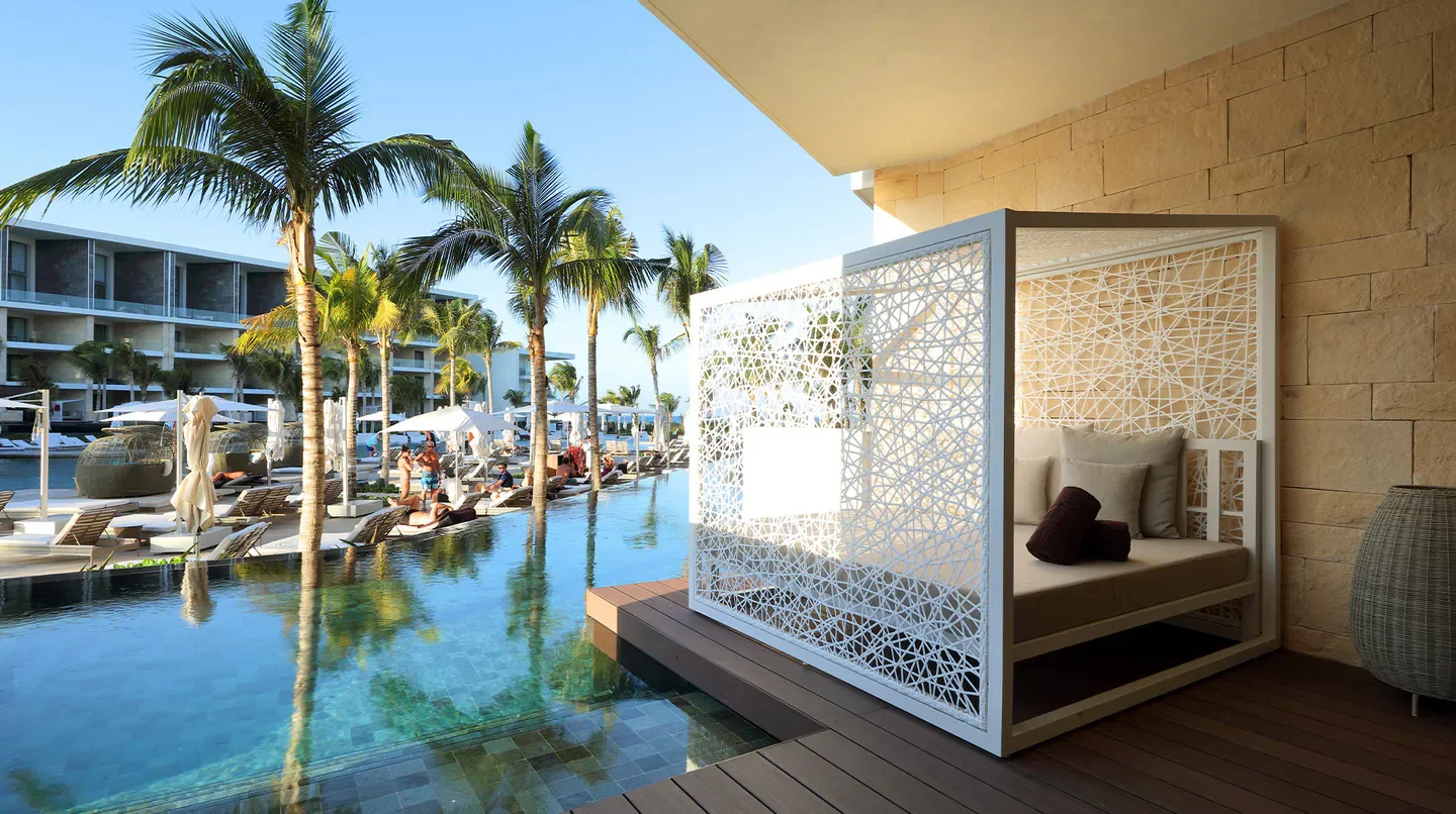 Relaxing pool and lounge area at TRS Coral Hotel in Cancun, Mexico.