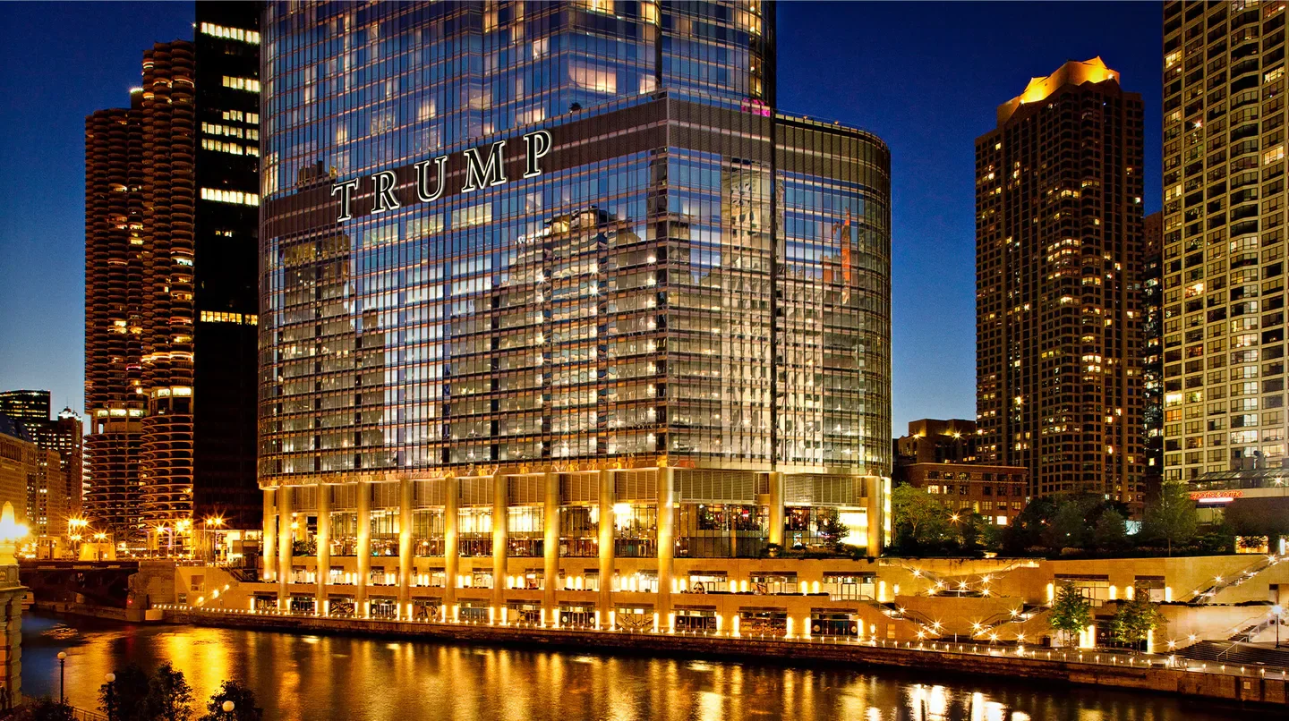 Trump International Hotel & Tower Chicago at night, along the Chicago River.