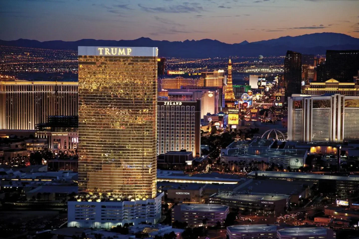 Trump International Hotel Las Vegas at night, overlooking the iconic Las Vegas Strip.