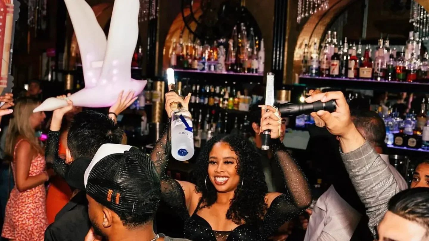 Party at Truth and Alibi nightclub in Dallas with people and a giant swan
