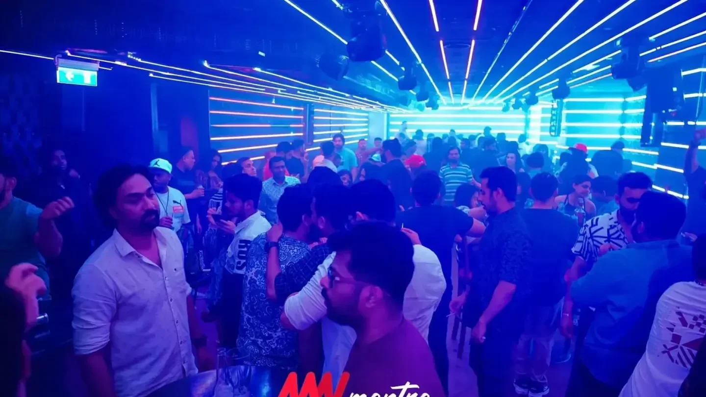 Energetic crowd inside TTD CLUB Abu Dhabi, enjoying the nightlife with vibrant lighting.