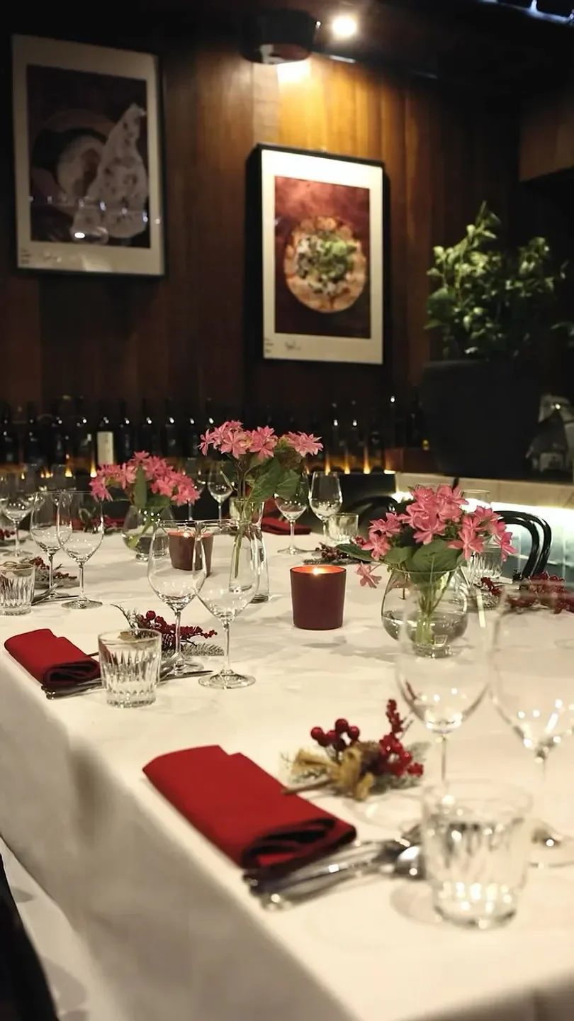 Elegant dining table at Tulum Restaurant in Melbourne with flowers and candles.